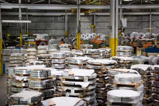 National Material Company’s Stony Island plant, with many stacks of rolled steel in a factory setting.