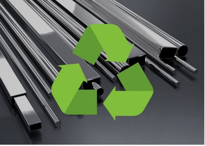 Shiny metal bars of various shapes arranged on a reflective surface, overlaid with a green recycling/sustainability symbol.